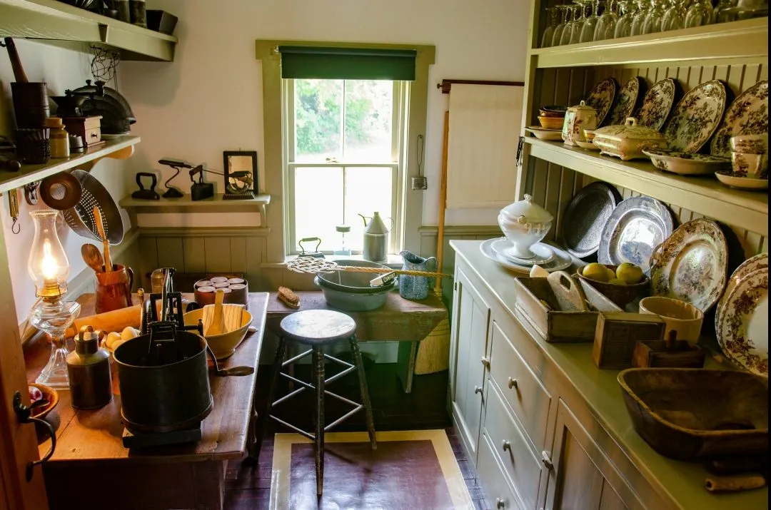 The Green Gables kitchen. In the cupboard, cups, plates, glasses, trays and dishes.